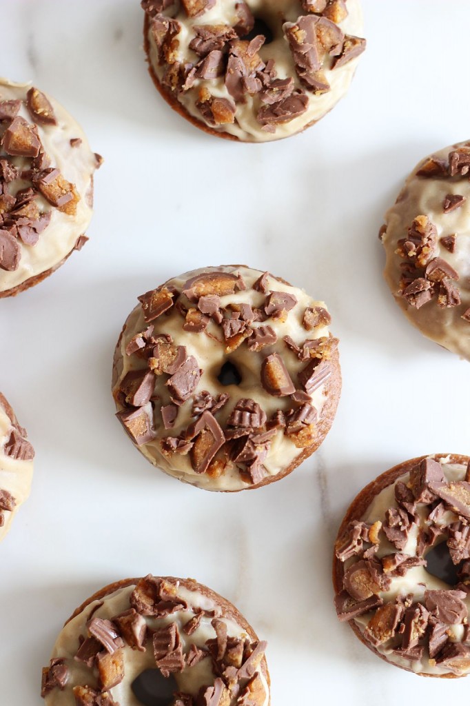 Baked chocolate donuts with peanut butter glaze and reese's peanut butter cups 13