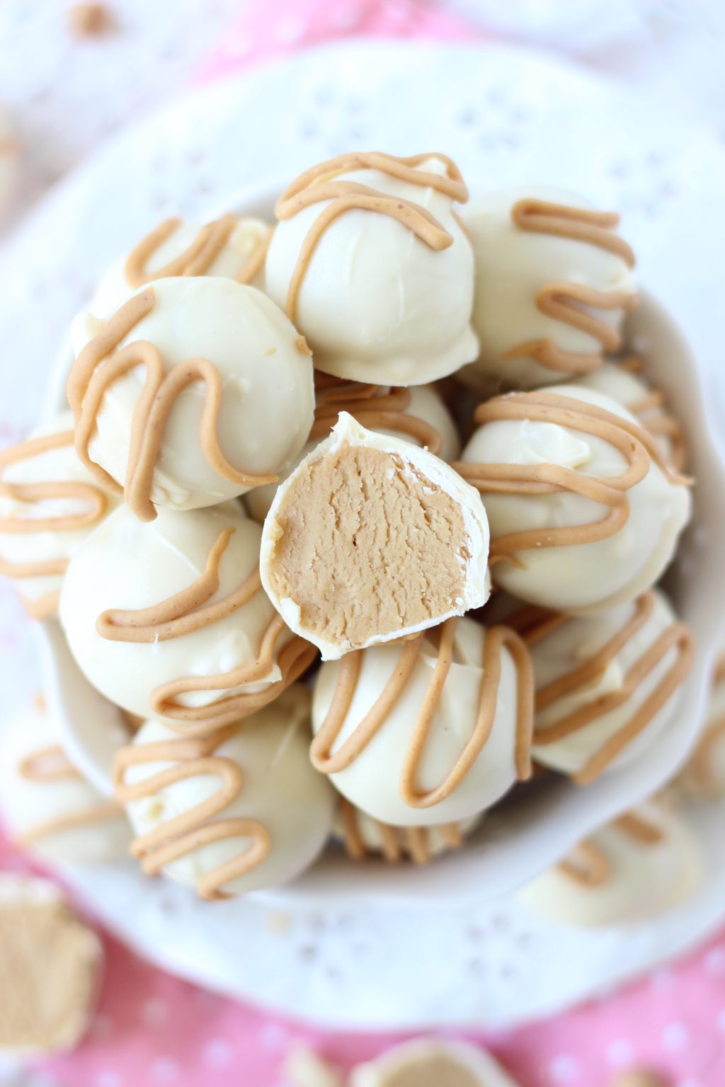 Traditional peanut butter buckeyes, dunked in a white chocolate bath, with ...